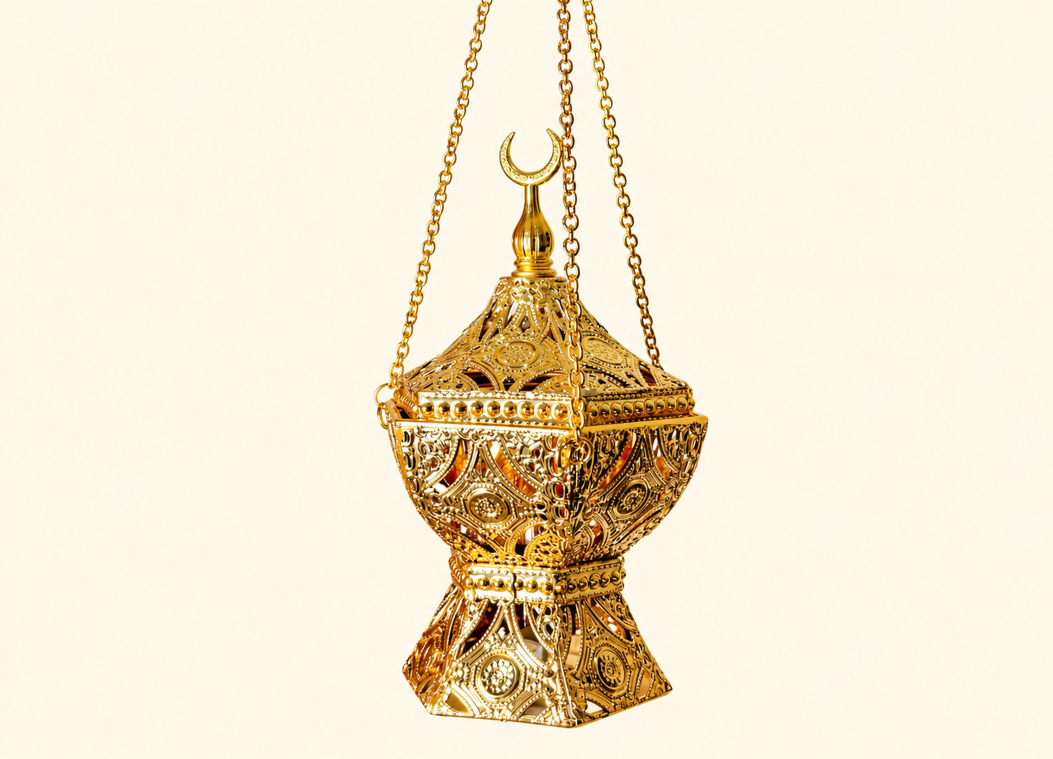 Ornate gold bakhoor burner with Arabic design, hanging chain, and incense smoke